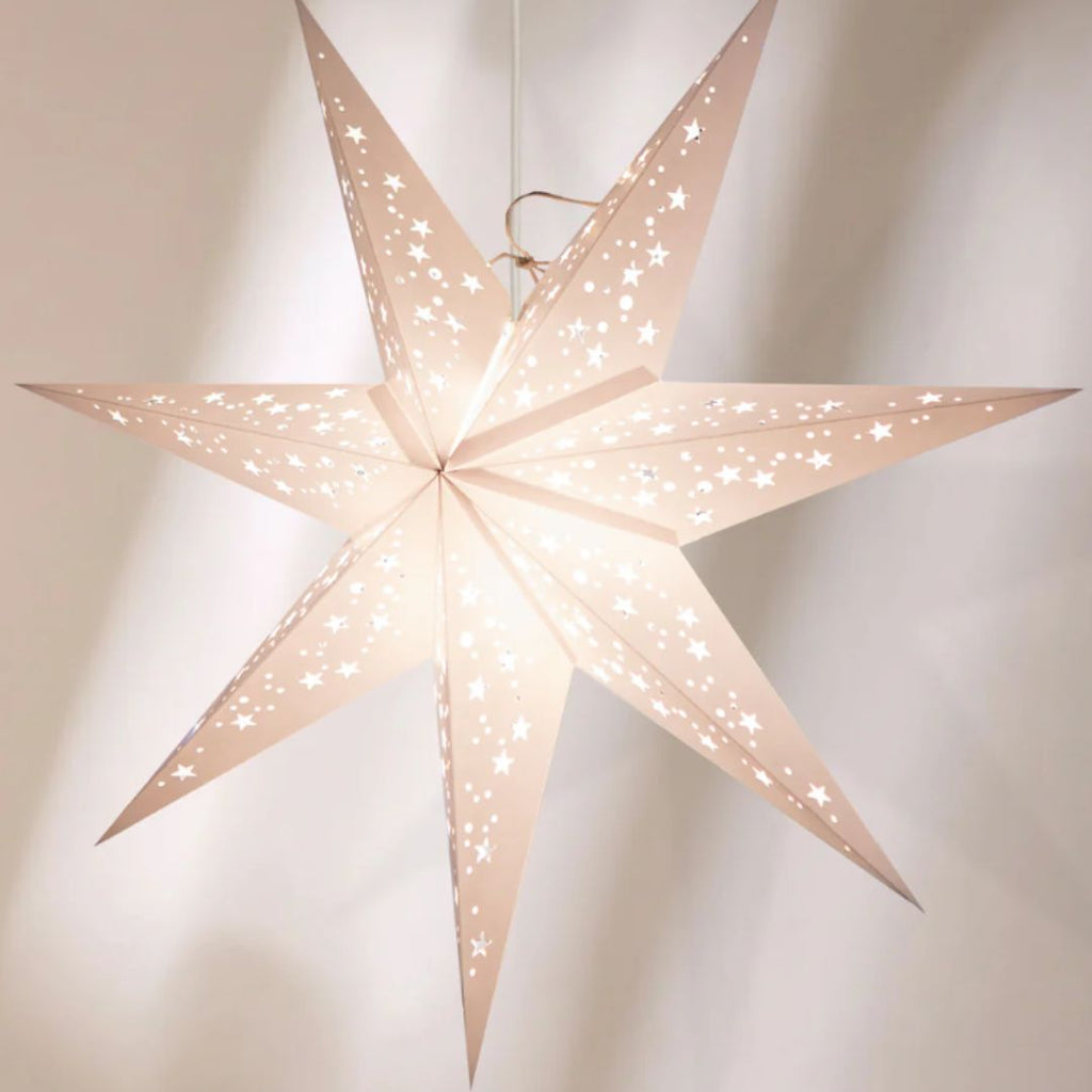 Star-shaped lantern with a soft glow on a neutral background. Made in India by Paperstarlights, Venus white